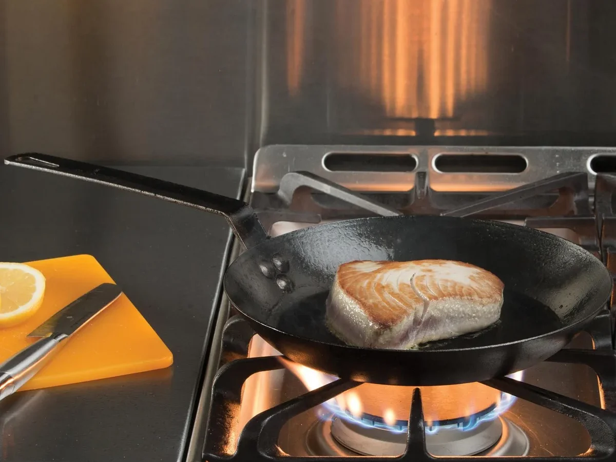 can you put cooking vinegar or tomato sauces in newly seasoned carbon steel in a carbon steel skillet safely