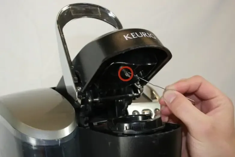 can you put re-using single-use k-cup pods causing needle puncture clog in a dual coffee maker for single pod and pot safely