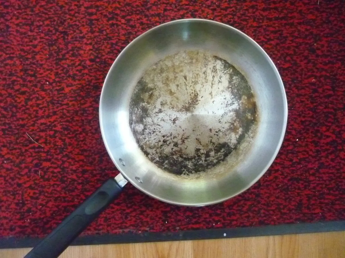 how to clean stainless steel saute pan with helper handle and remove stubborn burnt tomato sauce rings around interior rim