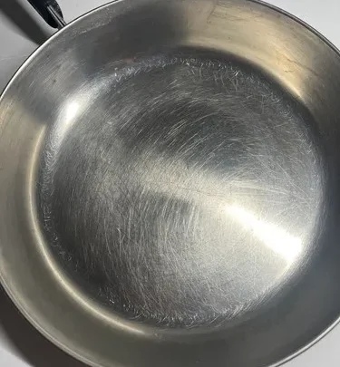 how to fix 5-ply stainless steel skillet pan warping or bowing in middle on high electric stove