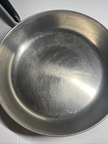 how to fix 5-ply stainless steel skillet pan warping or bowing in middle on high electric stove