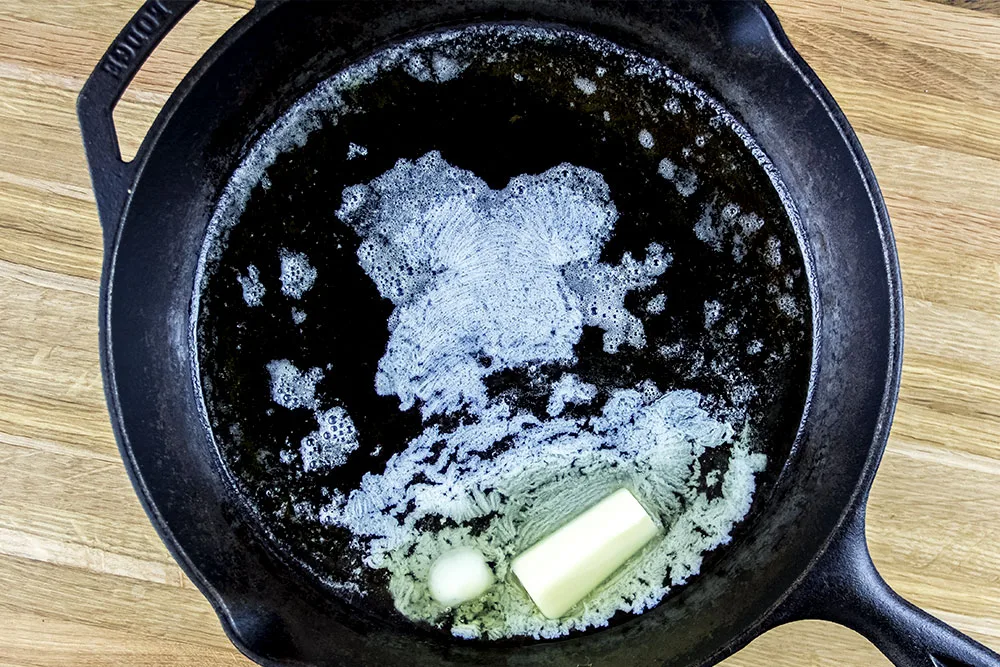 preheated cast iron skillet with melted butter